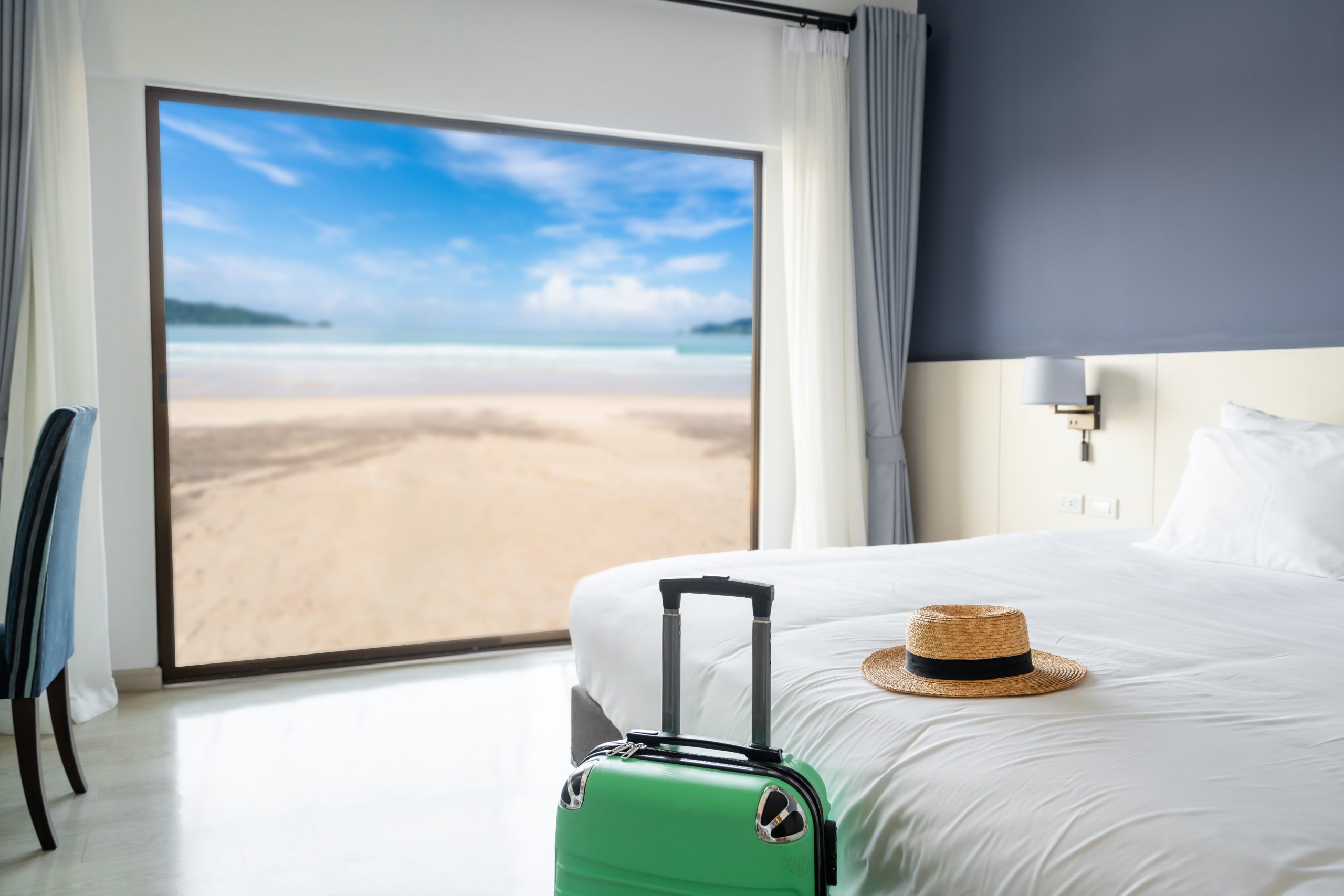 Luxury sea view hotel room with baggage, Travel concept